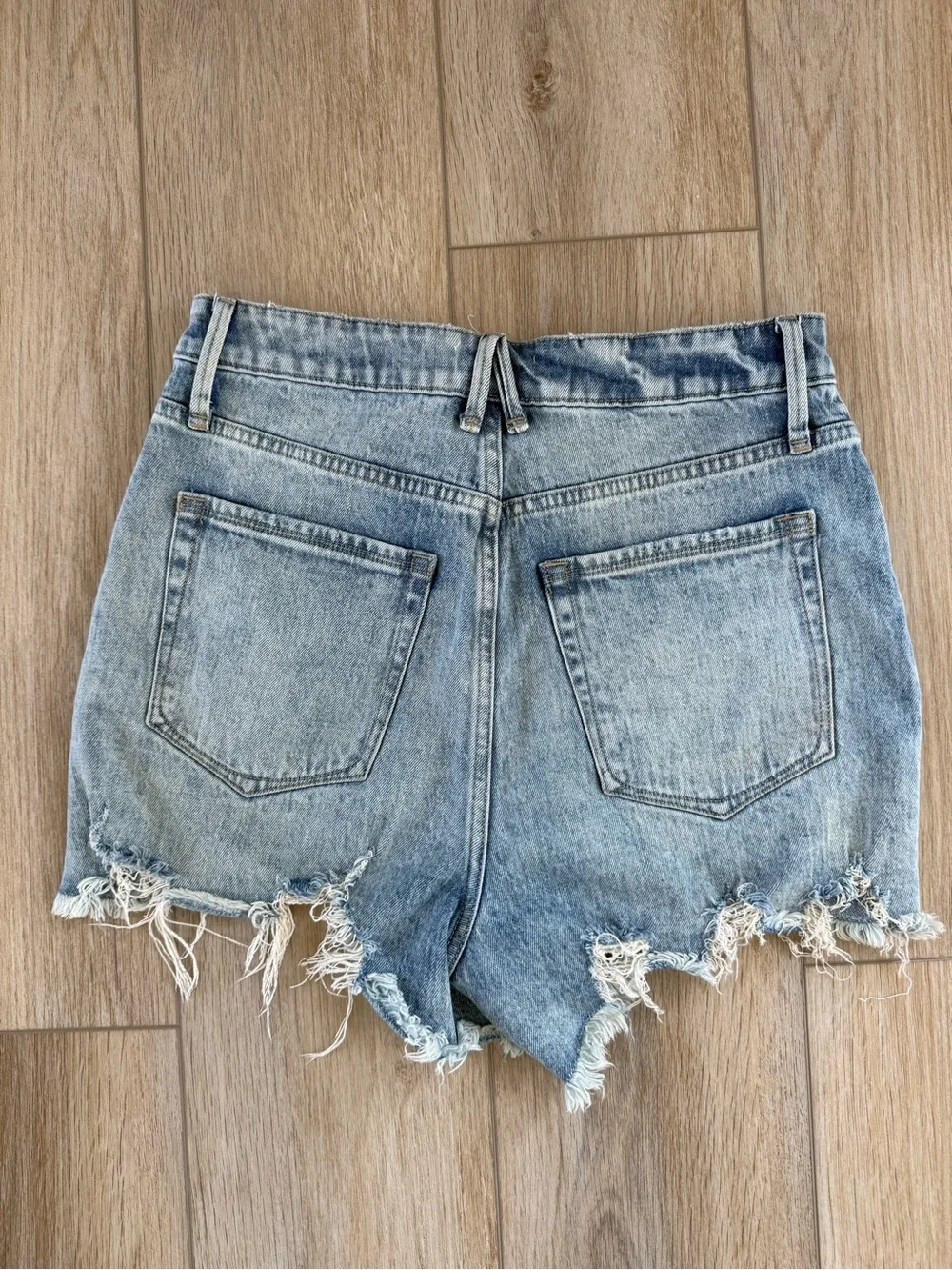 Good American Light Blue Distressed Denim Cutoff Shorts